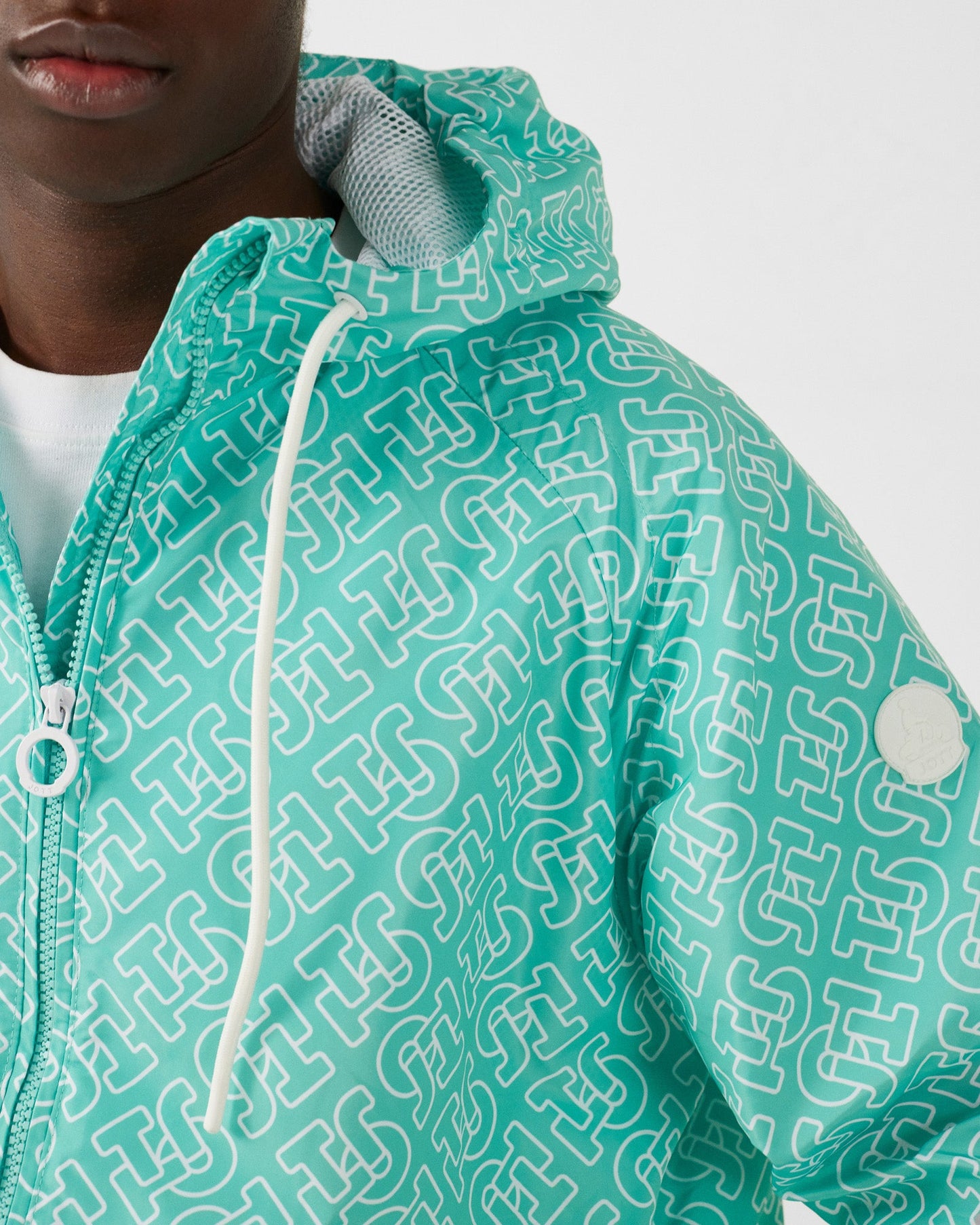 Blouson coupe-vent léger à capuche Mono lagon Storm monogram