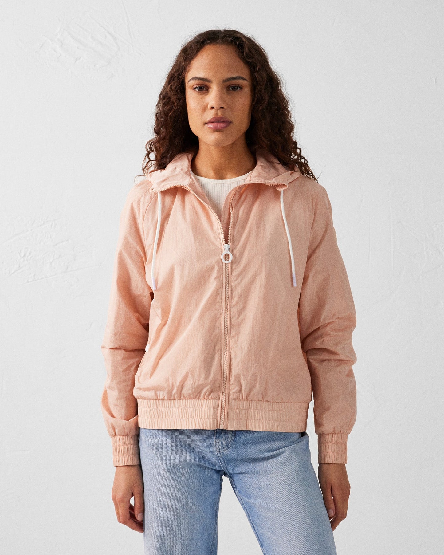 Blouson coupe-vent léger à capuche Pêche clair Alize