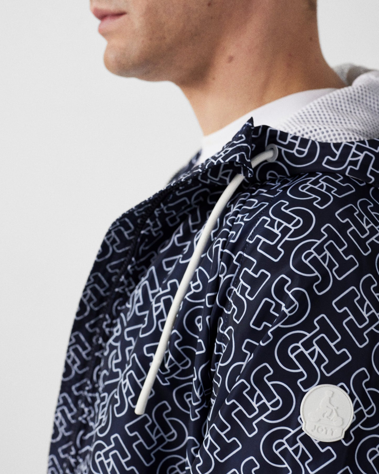 Blouson coupe-vent léger à capuche Mono marine Storm monogram